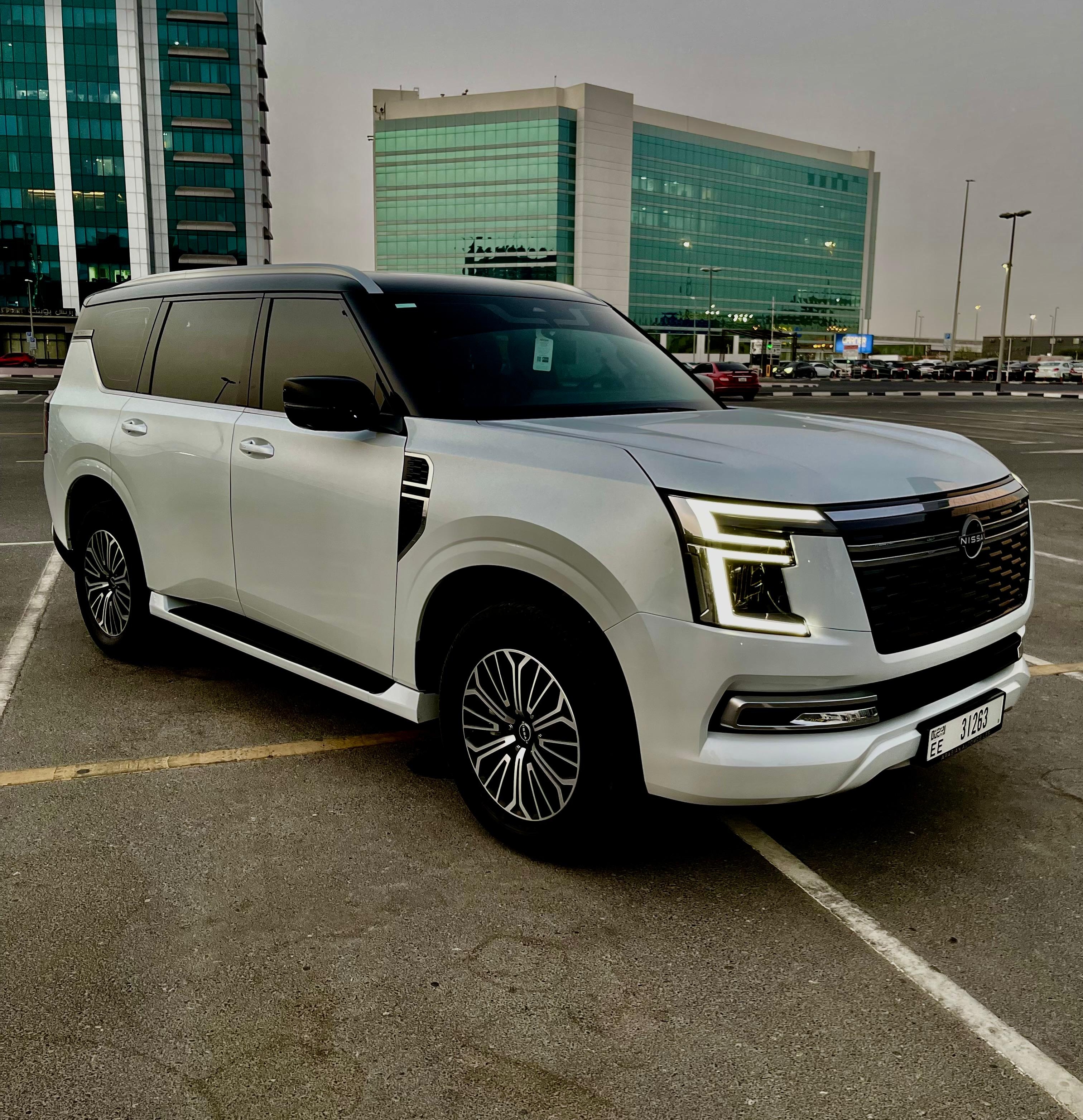 Cheap Nissan Patrol Platinum white interior Red  2026 Hire dubai