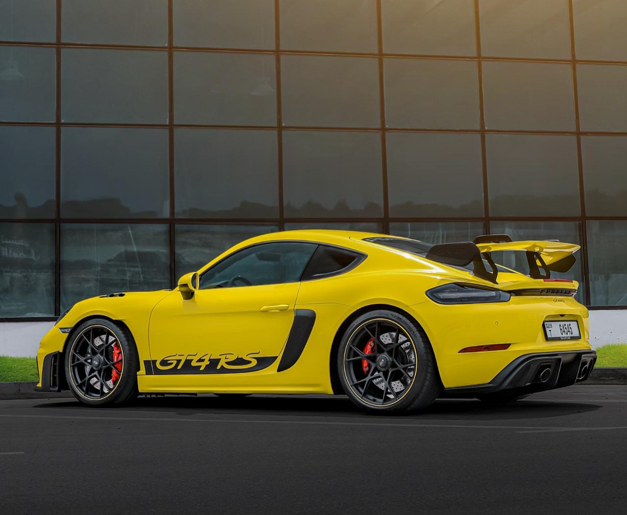 Rent Porsche Cayman YELLOW 2023 in Dubai , UAE 