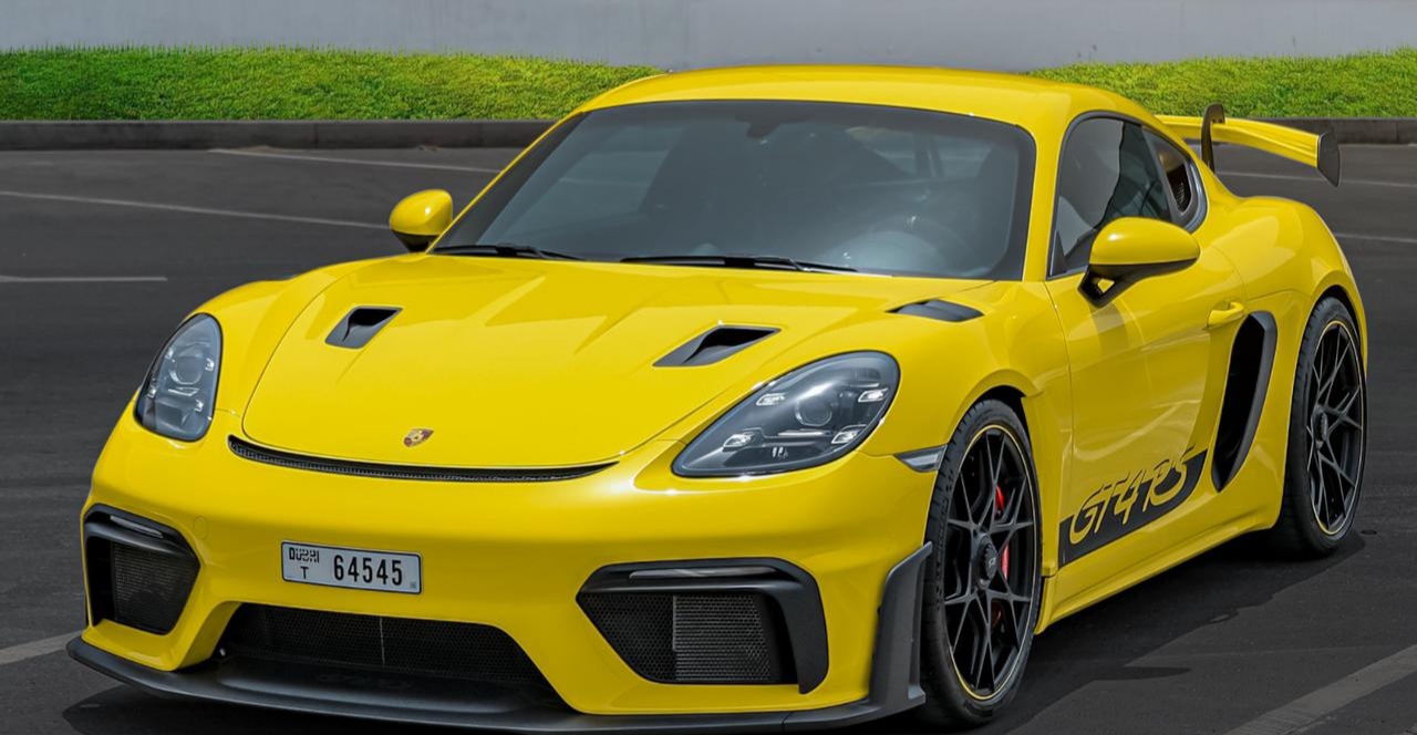Rent Porsche Cayman YELLOW 2023 in Dubai , UAE 